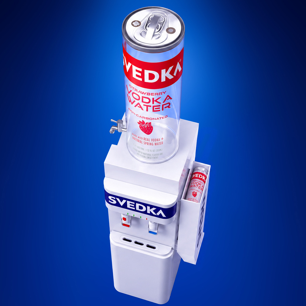 Overhead view of the SVEDKA Water Cooler showing the giant transparent can, side tap, can caddy, and hot and cold dispenser taps